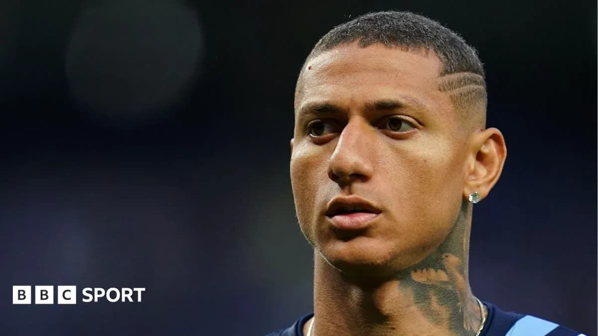 Close-up of player with short hair and tattoos
