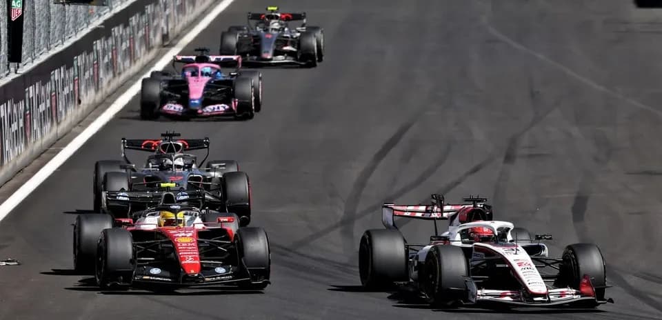 Formula 1 cars racing on track during competition