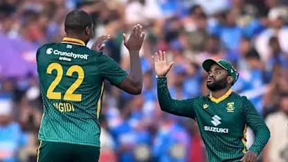 Two South African players celebrating a wicket