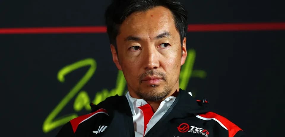 Team representative at press conference with serious expression