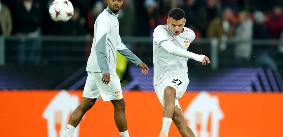 Player kicking a soccer ball during warm-up session