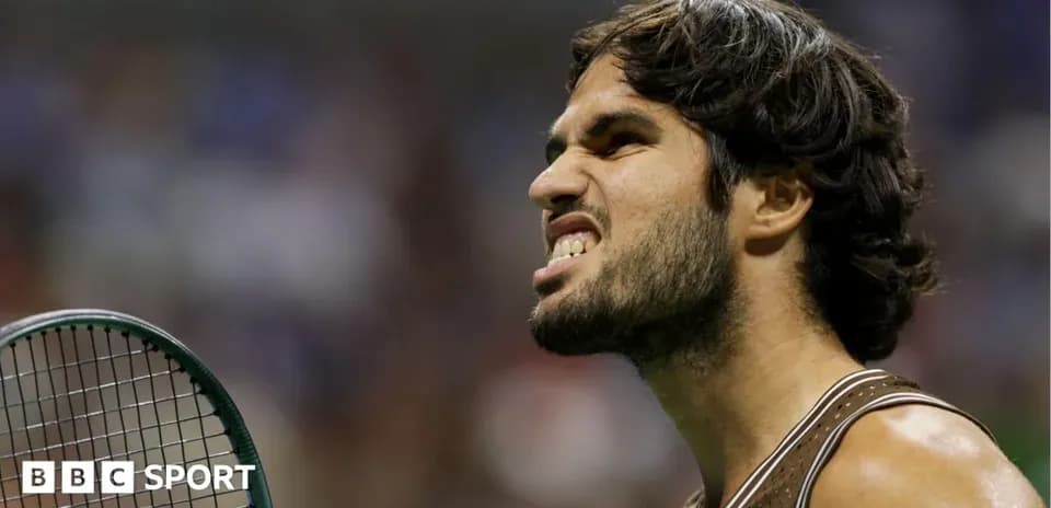 Tennis player celebrating with racquet during match