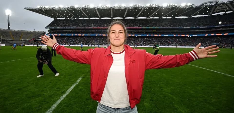 Female athlete celebrating on the pitch at stadium