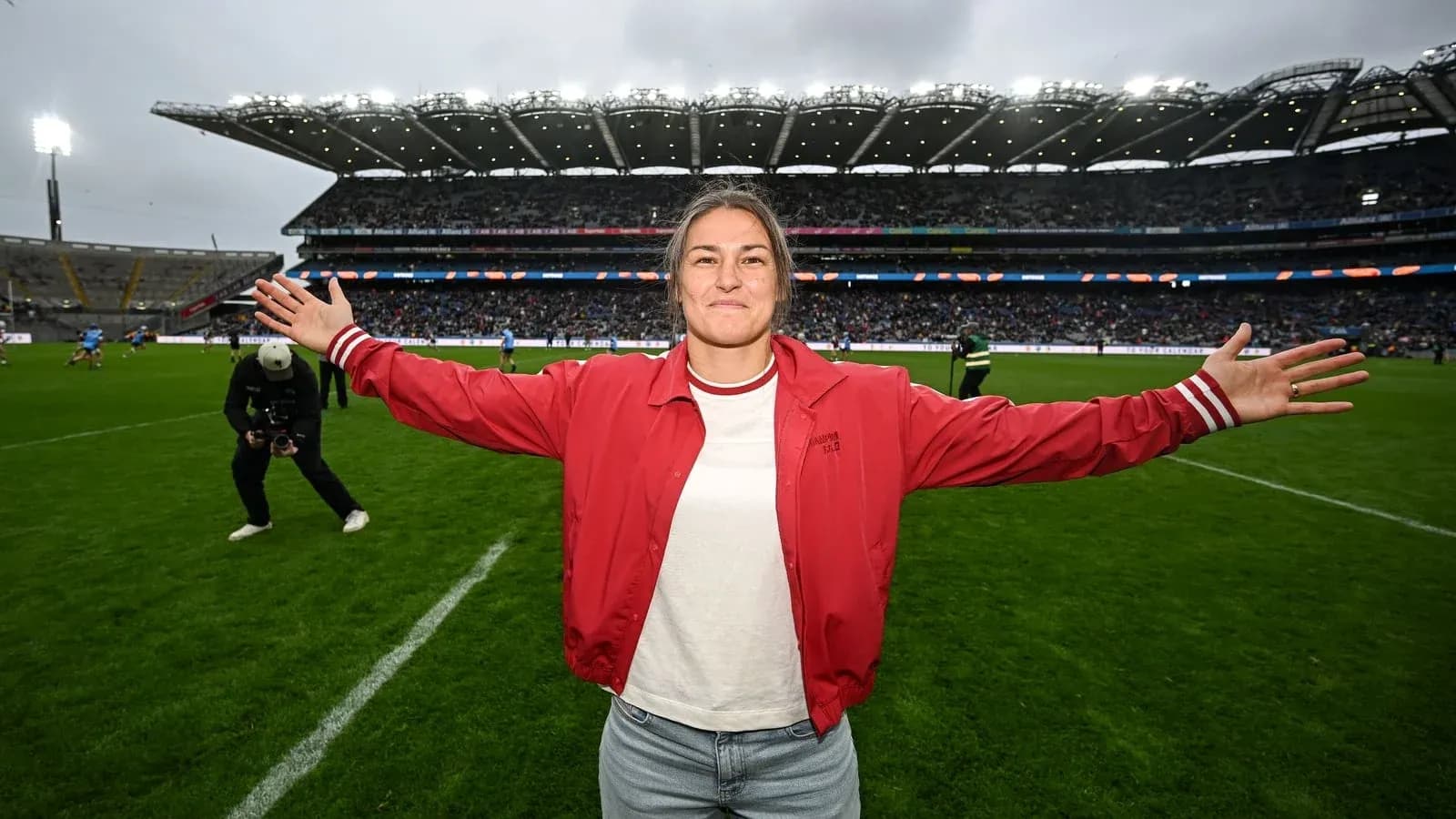 Female athlete celebrating on the pitch at stadium