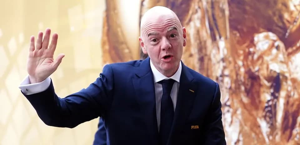 FIFA president speaking and waving at event