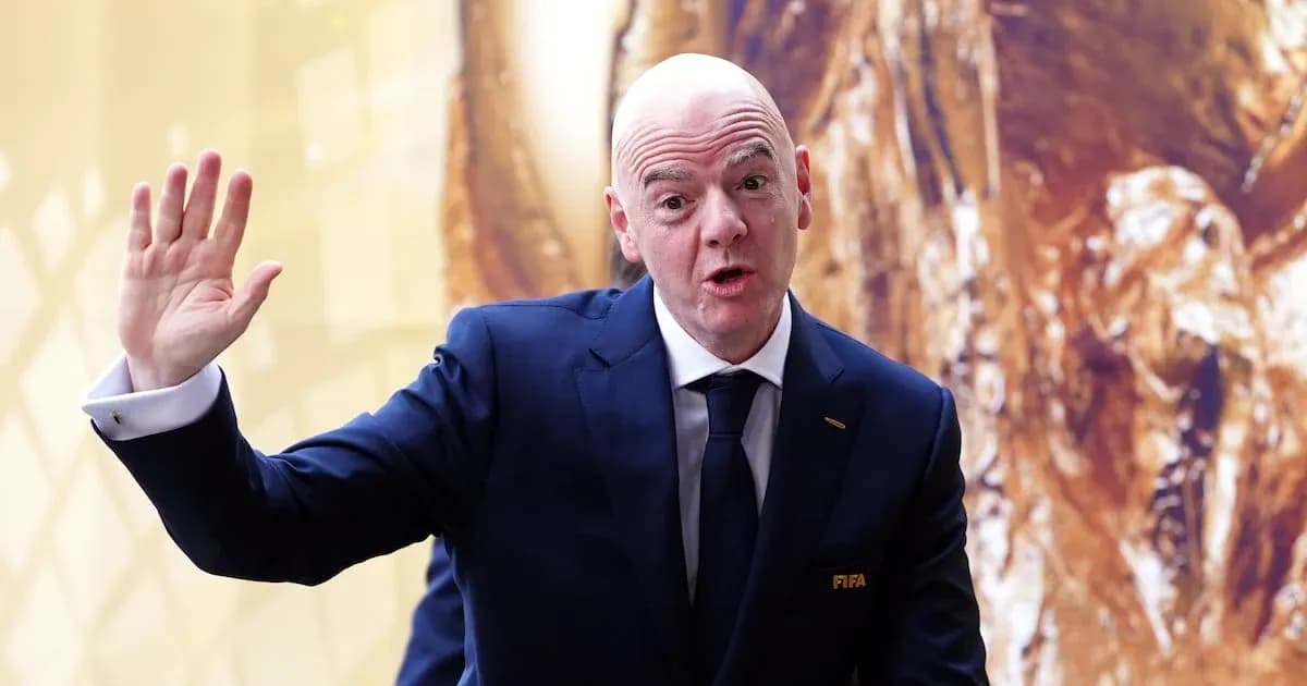 FIFA president speaking and waving at event