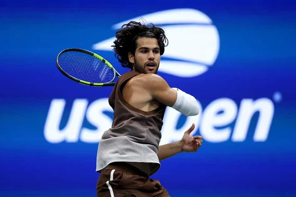 Tennis player hitting a backhand shot at US Open