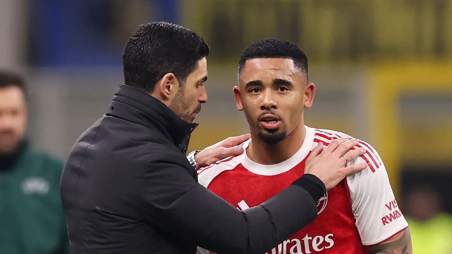 Manager talking to player during match substitution