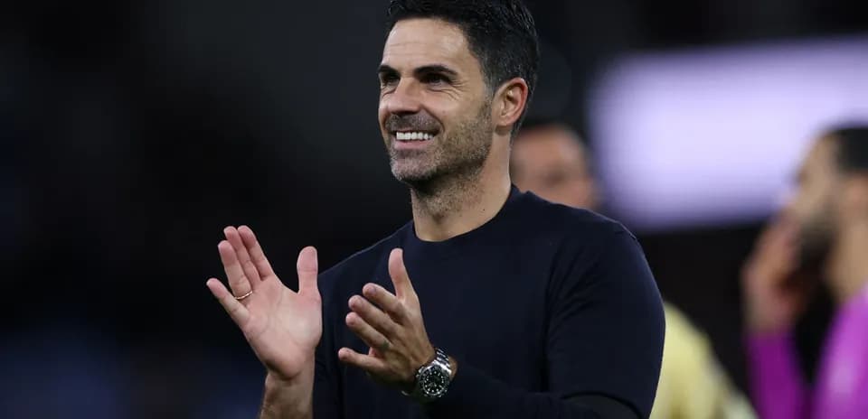 Manager applauding during a football match
