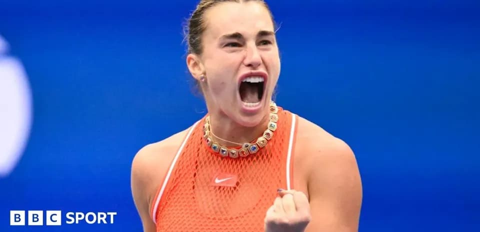 Tennis player celebrating victory with clenched fist