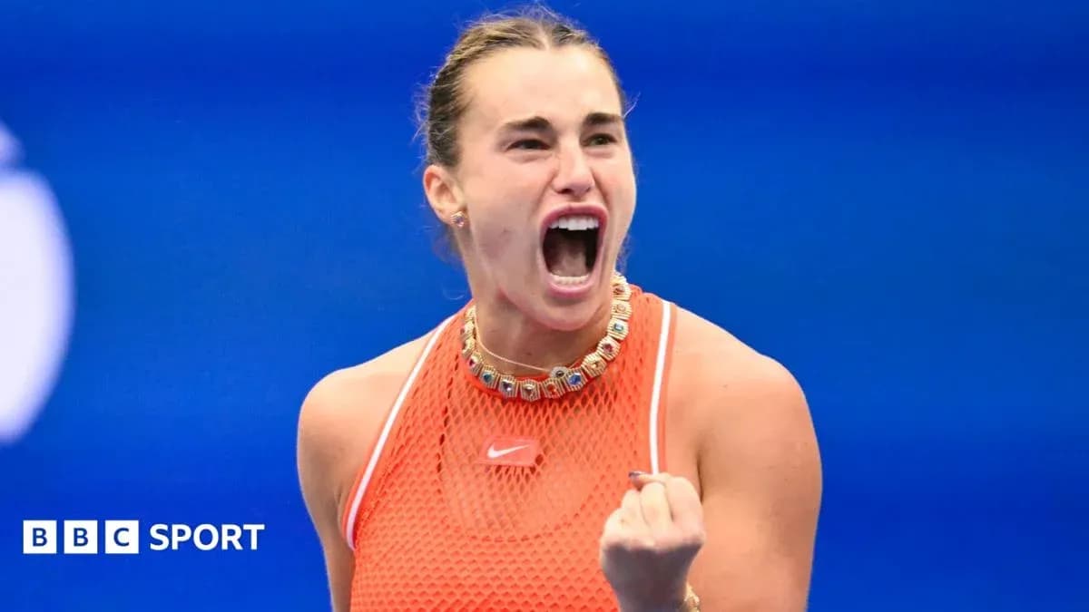 Tennis player celebrating victory with clenched fist