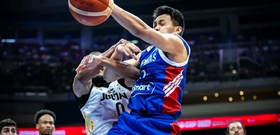 Player in blue jersey struggles for the ball