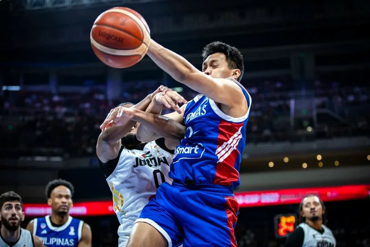 Player in blue jersey struggles for the ball