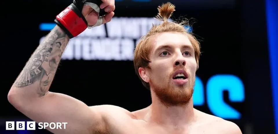Fighter celebrating victory in the ring