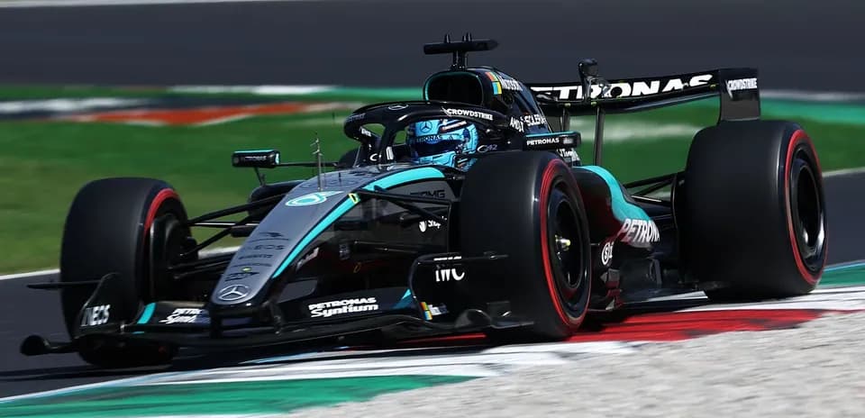 Mercedes F1 car driving on racetrack corner