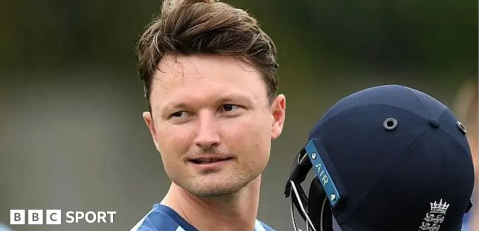Cricketer holding helmet during training session