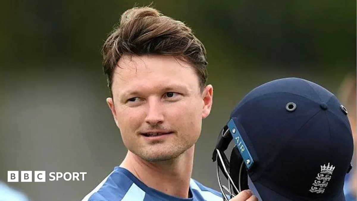 Cricketer holding helmet during training session