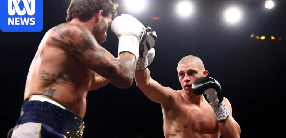 Two boxers exchanging punches in the ring