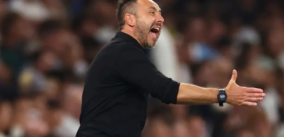 Coach gesturing during a football match
