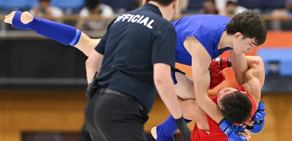 Athletes grappling during a competitive match