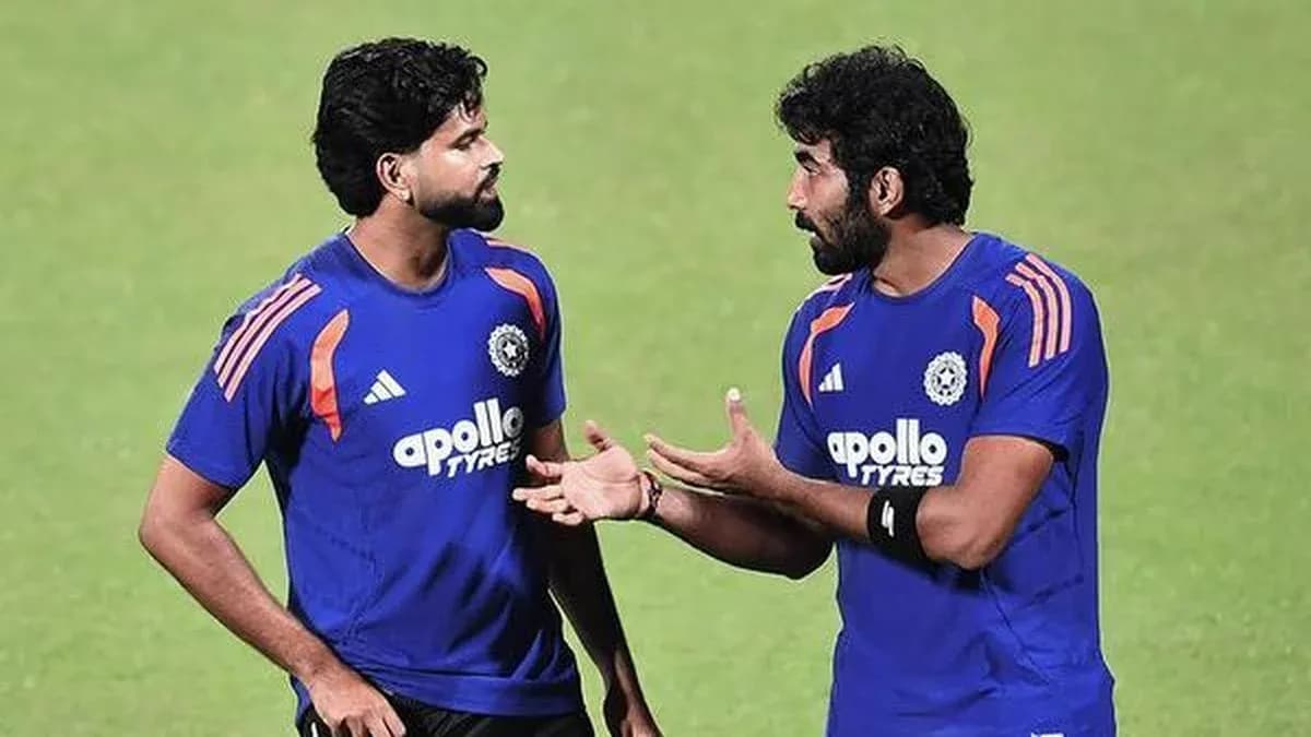 Two players discussing during cricket training session