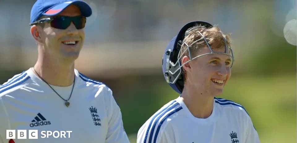 Two cricketers smiling during training session
