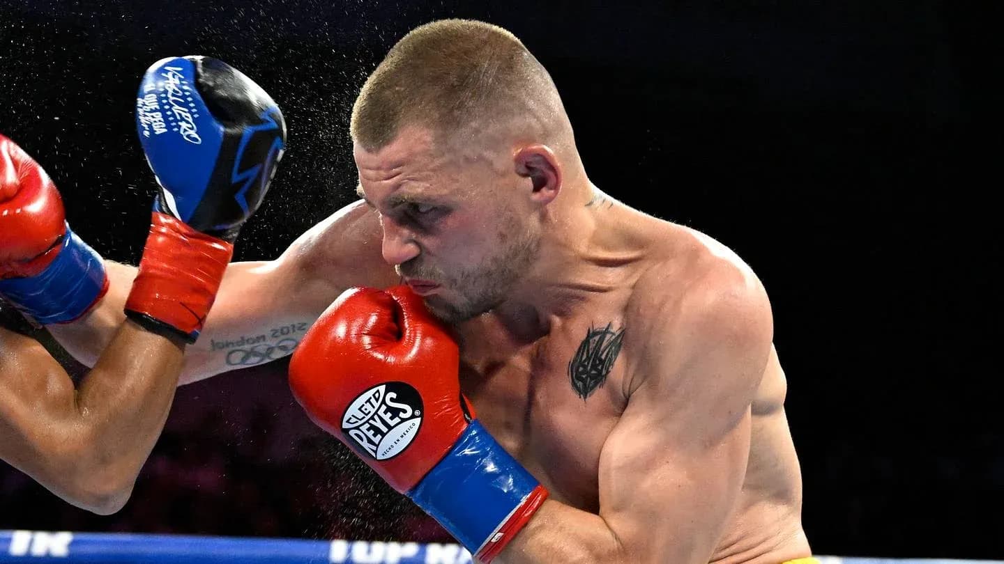 Boxer delivering a punch during a match