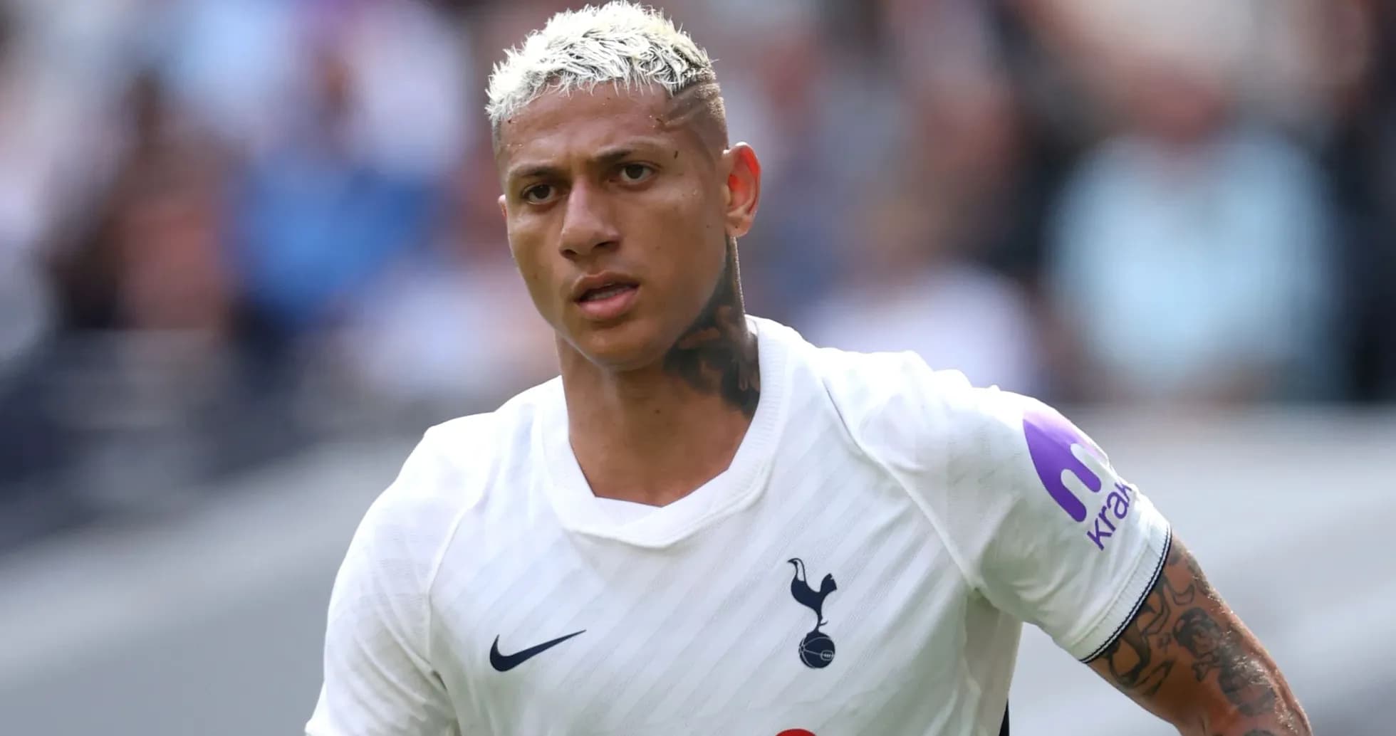 Player wearing Tottenham Hotspur kit on the pitch