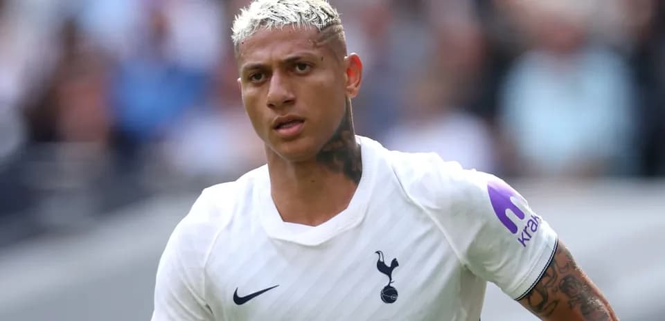 Player wearing Tottenham Hotspur kit on the pitch