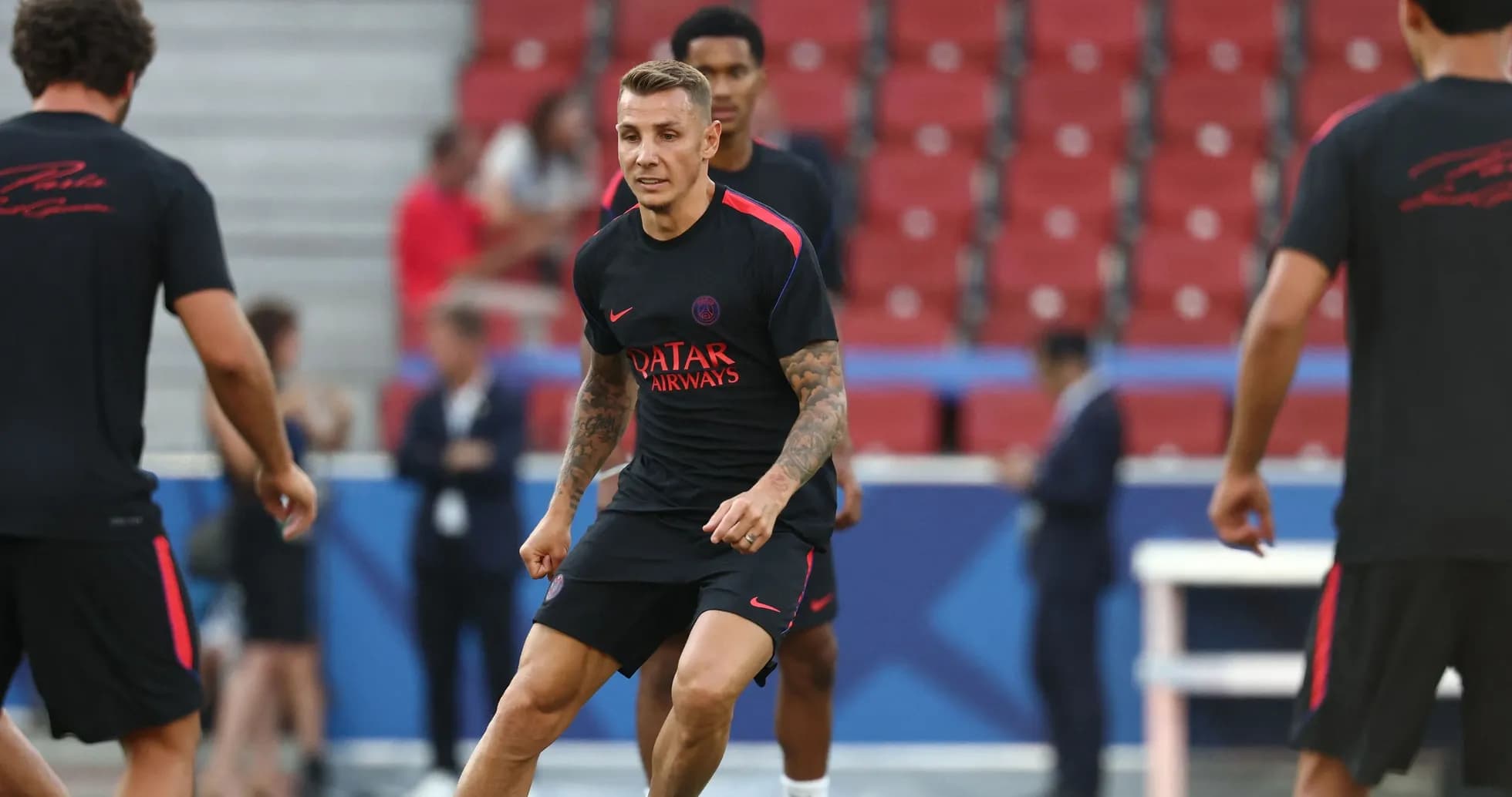 Player training on the pitch before a match