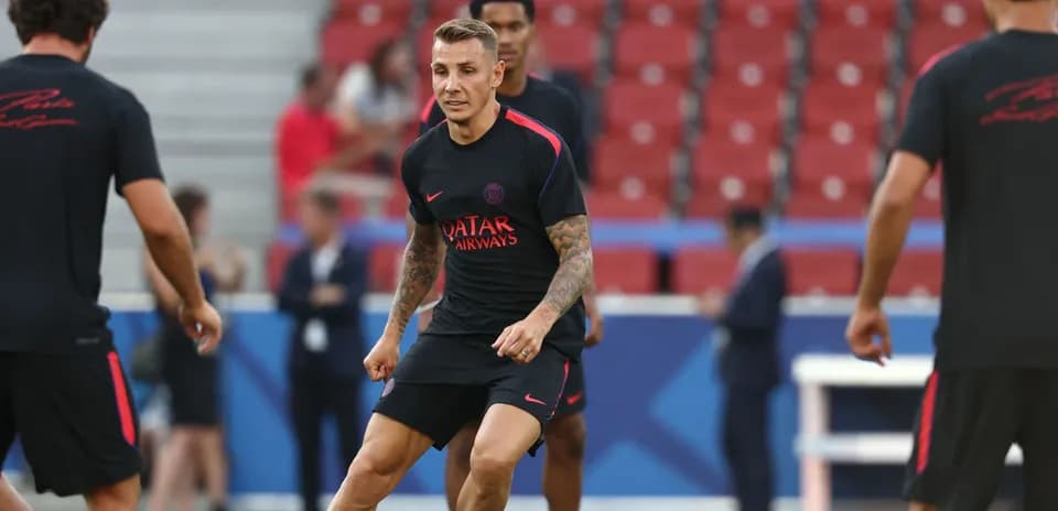 Player training on the pitch before a match