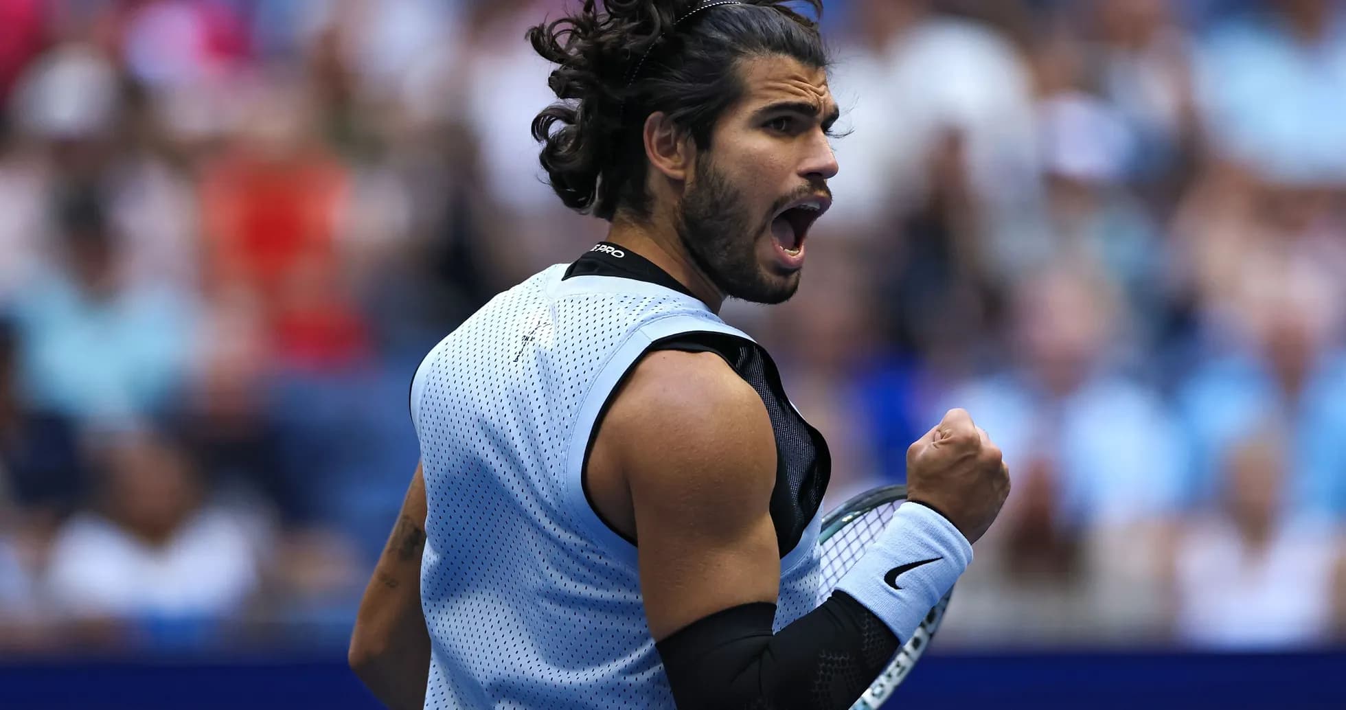 Tennis player celebrating during a match