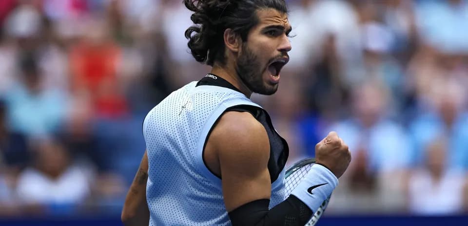 Tennis player celebrating during a match