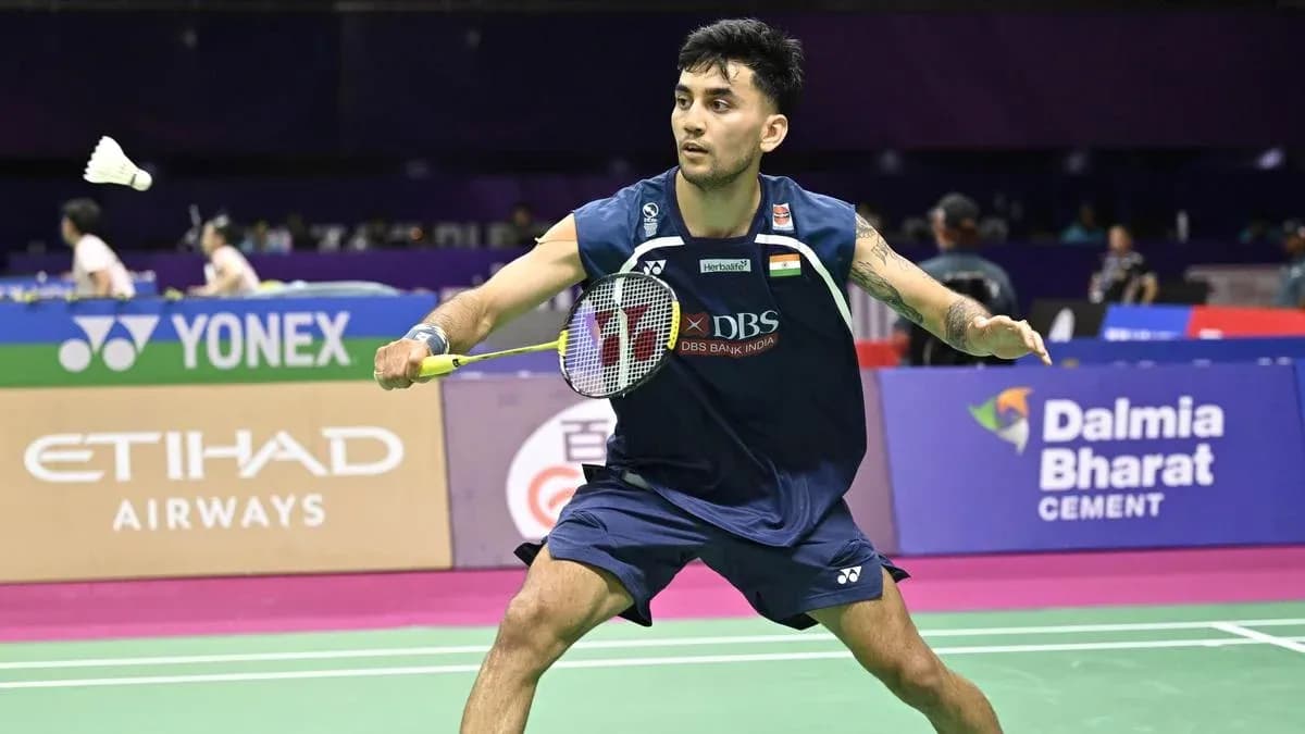 Player preparing to hit shuttlecock during badminton match