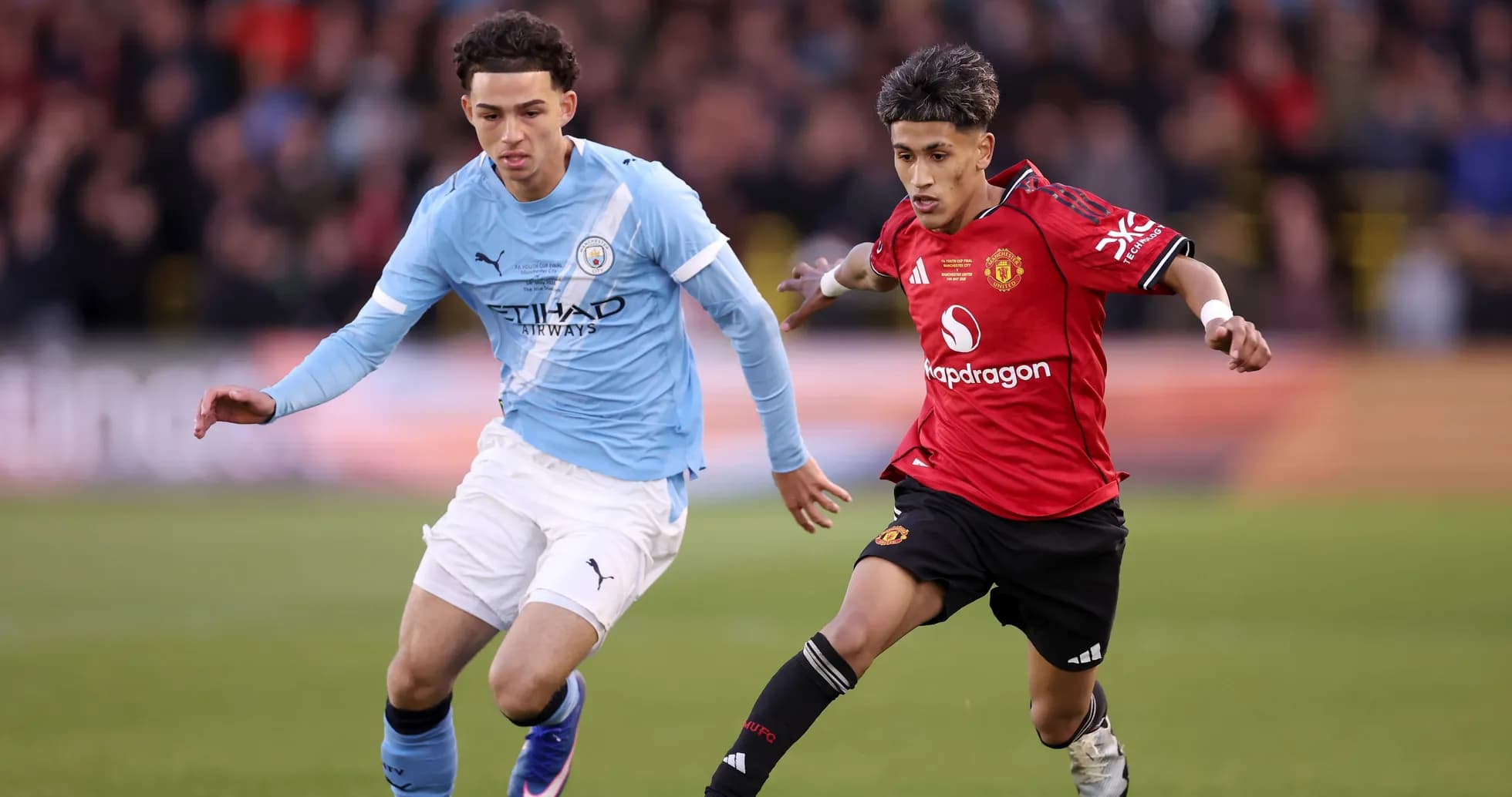 Manchester City and Manchester United players in action