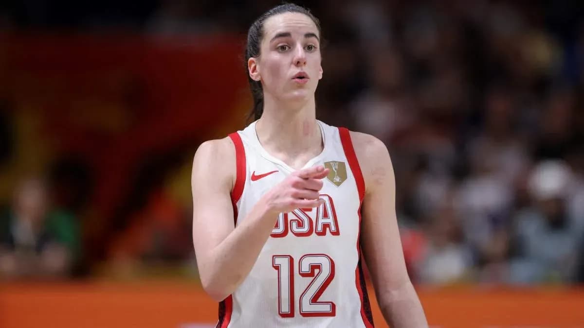 Player in USA jersey signaling during basketball game
