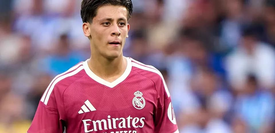 Player in pink Real Madrid jersey during match