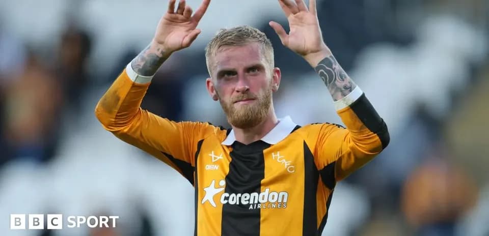 Player celebrating with raised hands after match