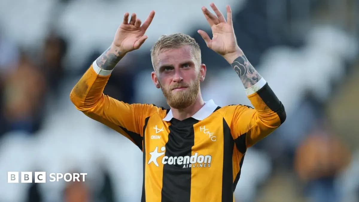Player celebrating with raised hands after match