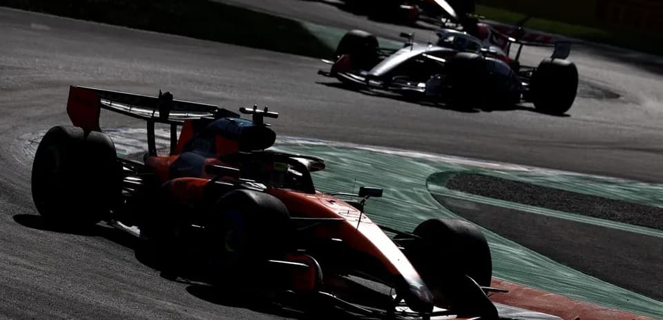 Formula 1 cars racing on track during competition
