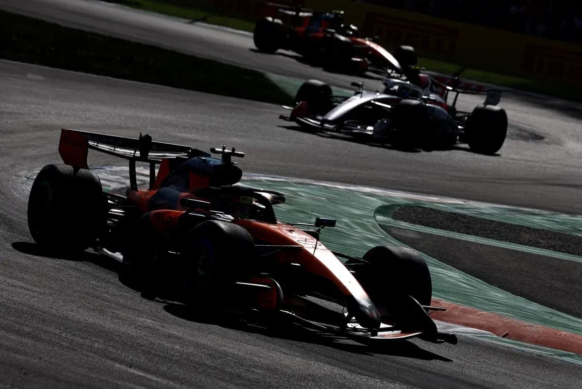 Formula 1 cars racing on track during competition