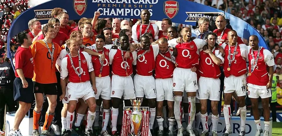 Arsenal players celebrating Barclaycard Premiership victory