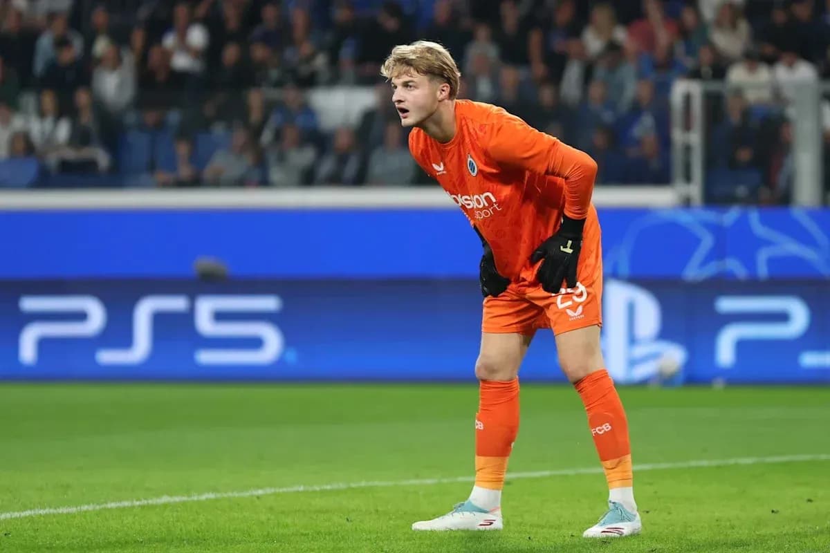 Goalkeeper in orange kit preparing for play