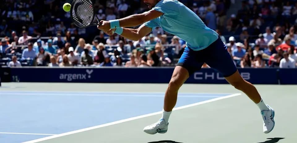 Player executing a forehand during tennis match