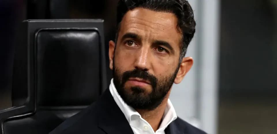 Coach sitting on bench during match