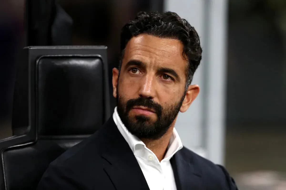 Coach sitting on bench during match