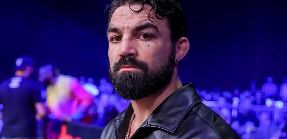 Man with beard in a crowd at an event