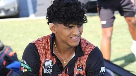 Player sitting on grass field during training session