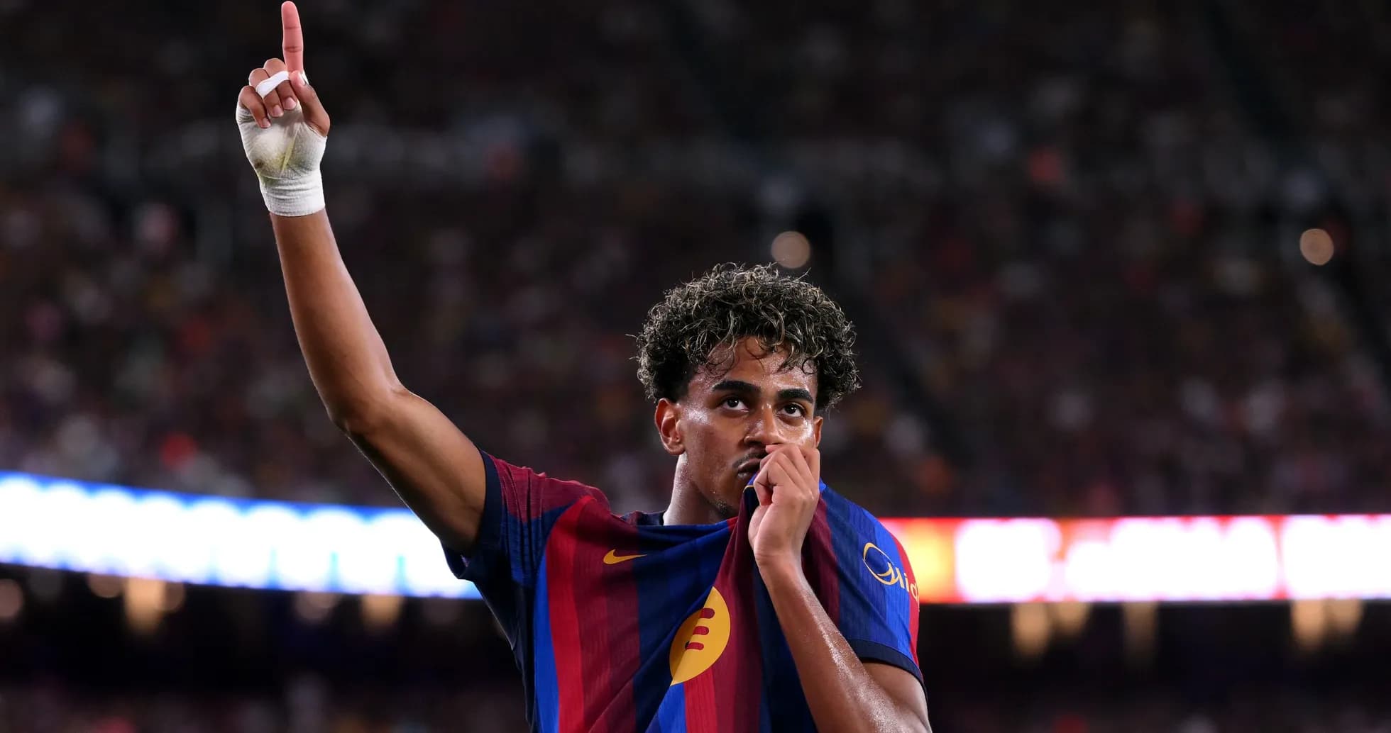Player celebrating by kissing club jersey