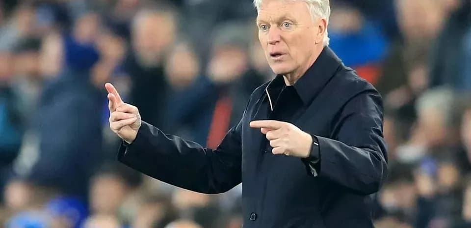 Manager giving instructions on the sidelines during match